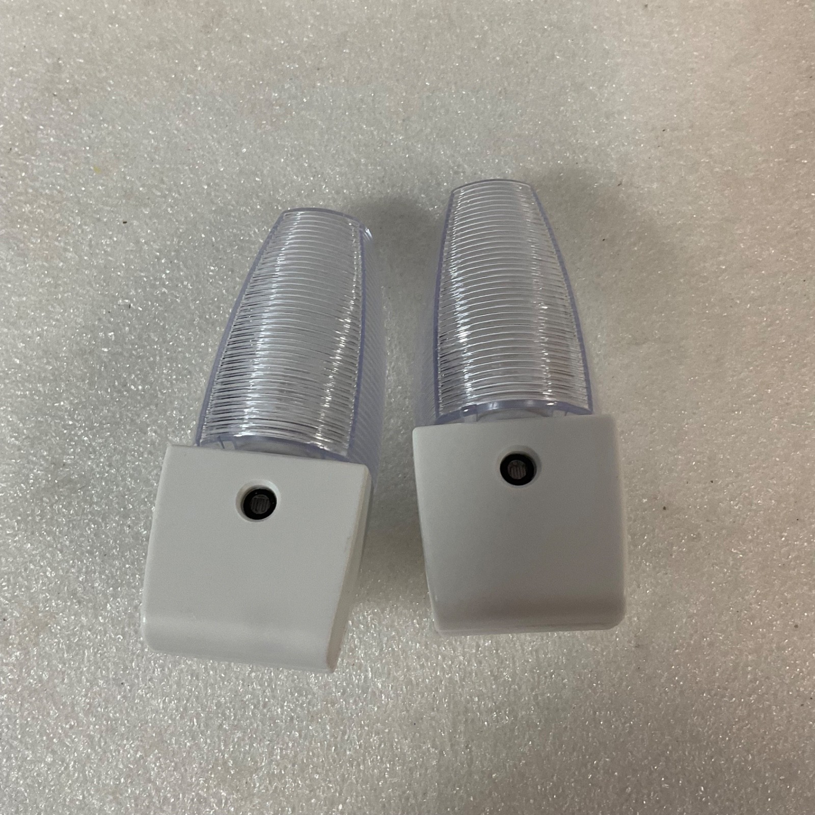LED Plug In Night Light 4in Ribbed Clear Lens White Base 2pc - Image 1