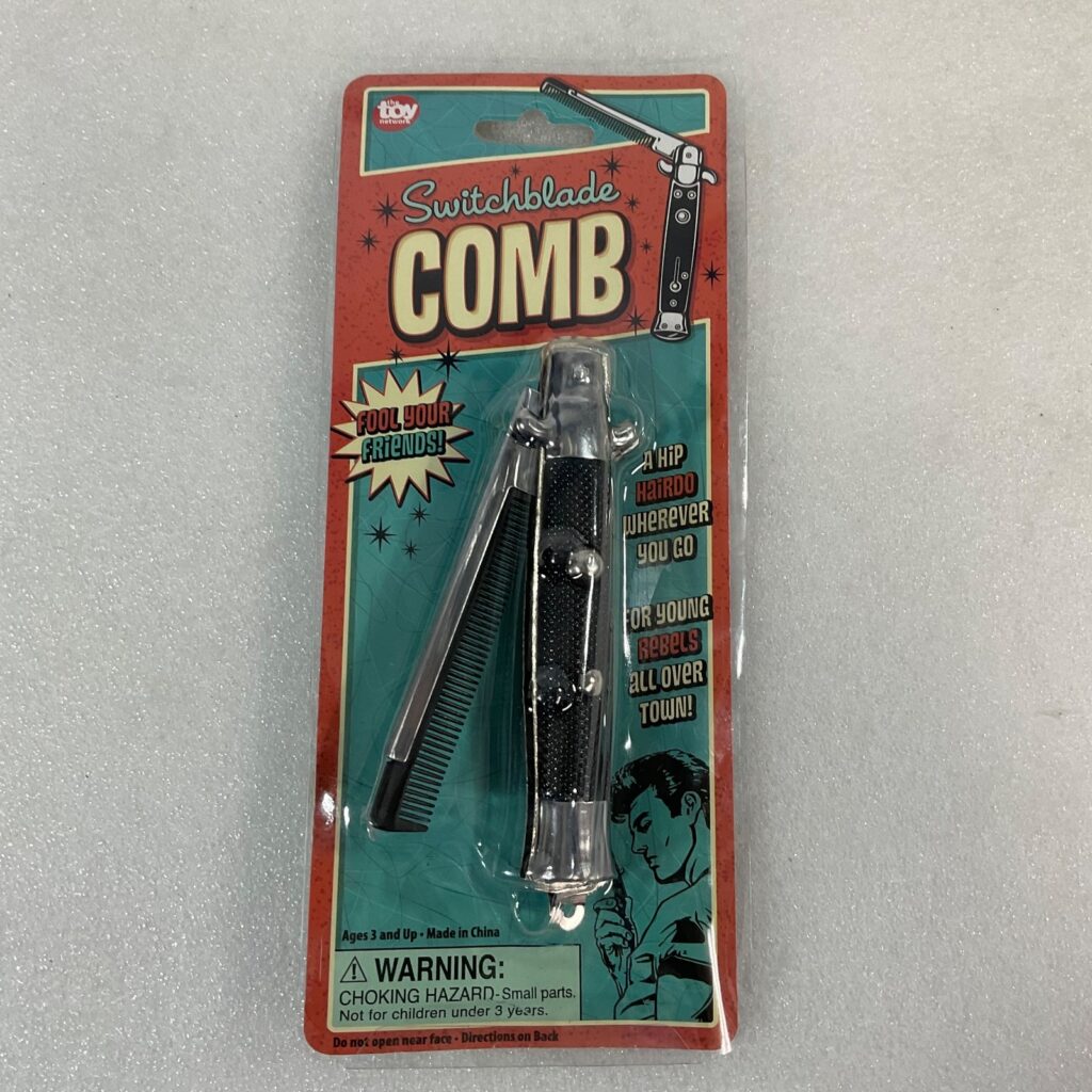 Switchblade Comb Push Button Pocket Hair Comb 9 in Novelty Toy Network - Image 1