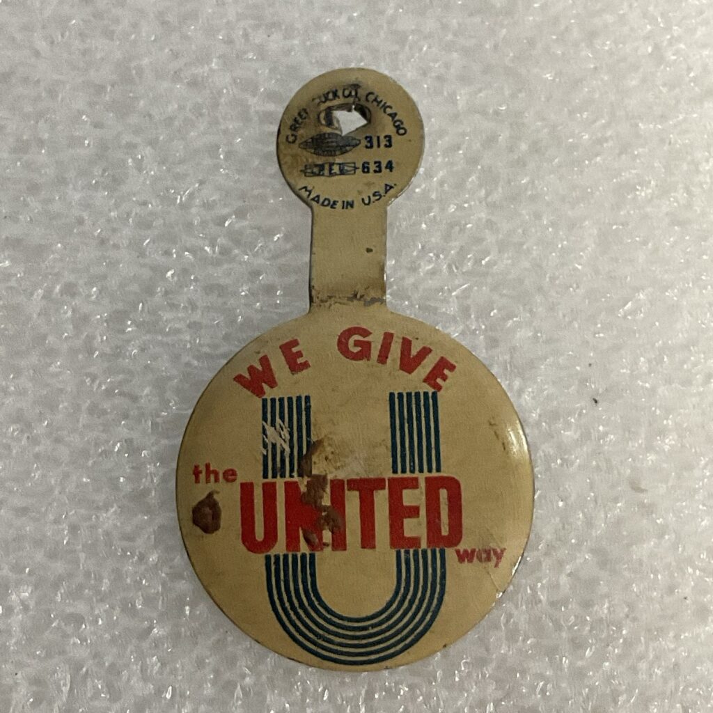 We Give The United Way Fold Over .75” Button Made By Green Duck Co - Image 1