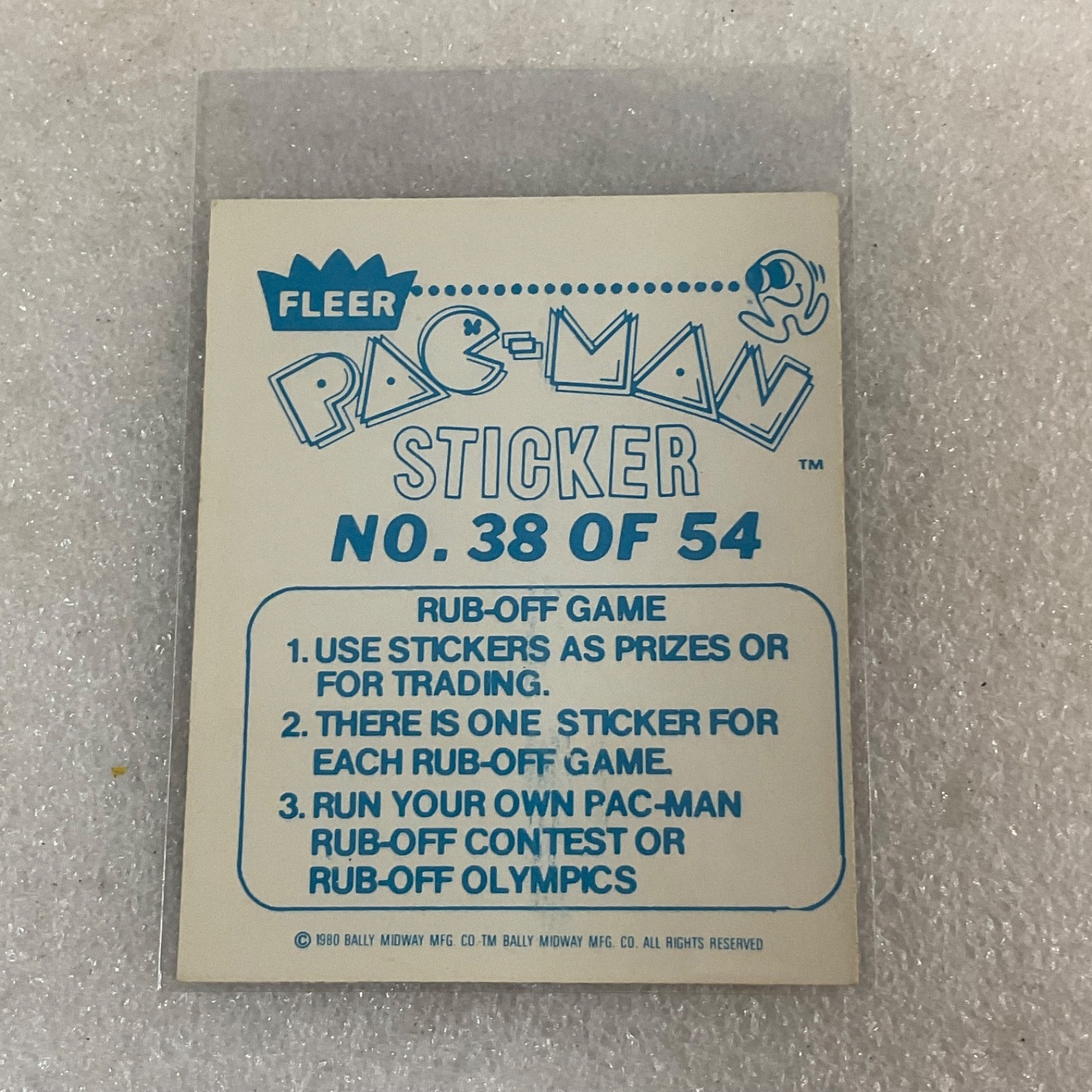1980 Fleer Pac-Man Sticker #38 Smile Pac-Man Is Watching Orange Ghost - Image 2