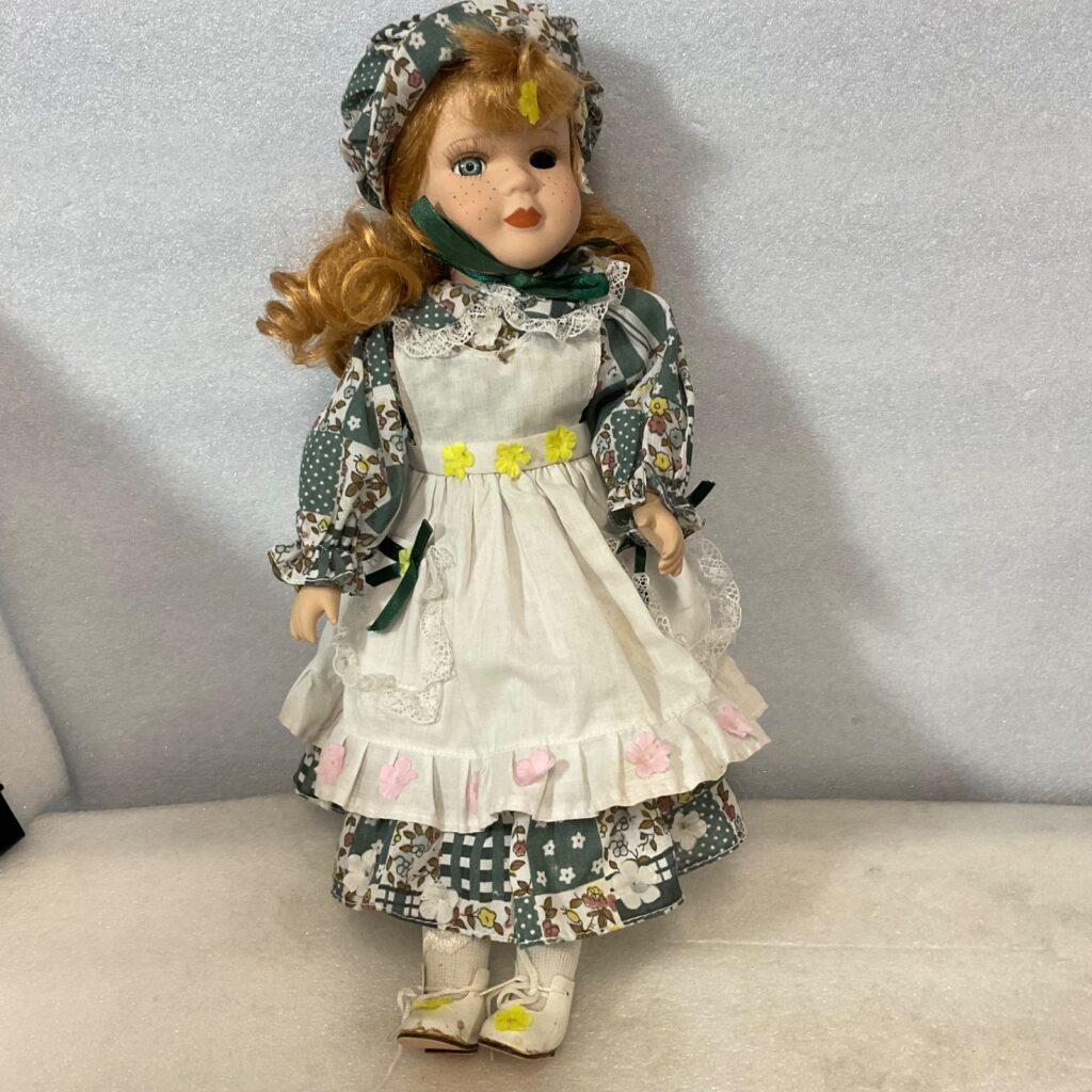 Collectible Doll 15in Red Hair Green Floral Dress Missing Eye - Image 1