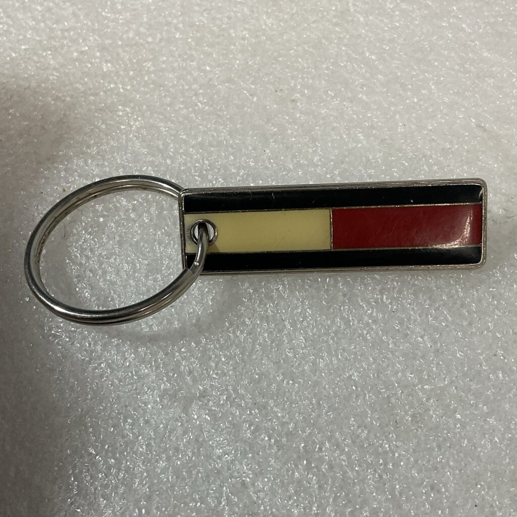 Tommy Hilfiger Metal Keychain Purse Charm Zipper Pull Red Yellow Black Stripe - Image 1