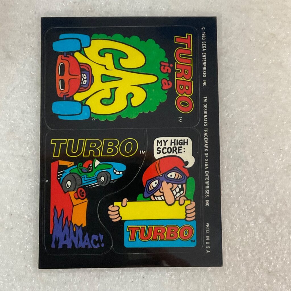 1983 Topps Video City Sega Turbo 3-Sticker Sheet Puzzle Back Vintage - Image 1