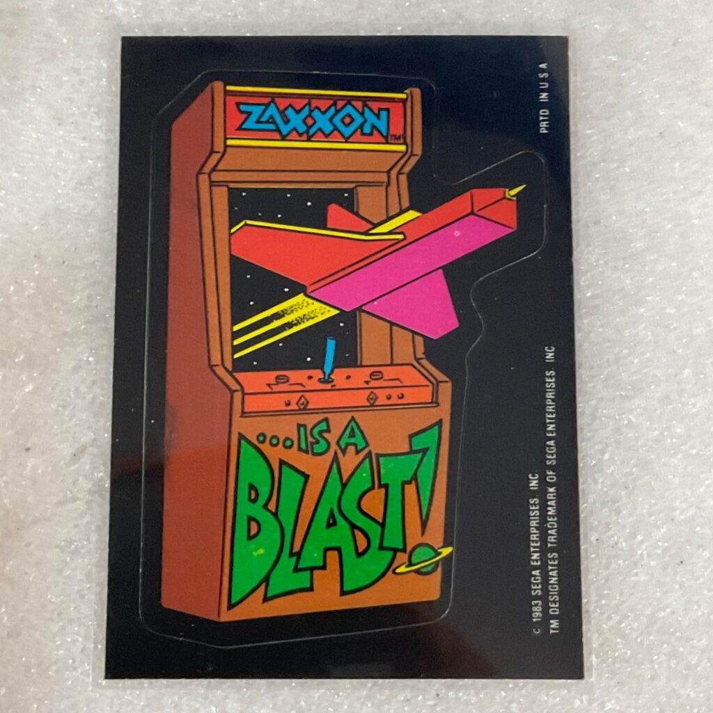 1983 Topps Video City Sega Zaxxon Is a Blast Sticker Card - Image 1