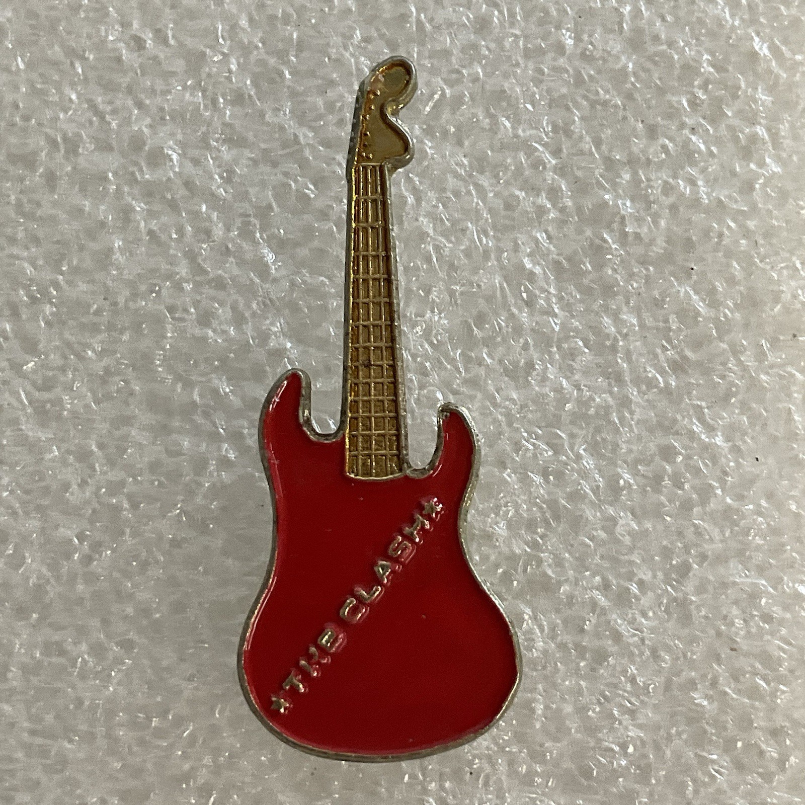 1980’s Vintage The Clash English Rock Band 1.5" Red & Gold Metal Guitar Pin - Image 1
