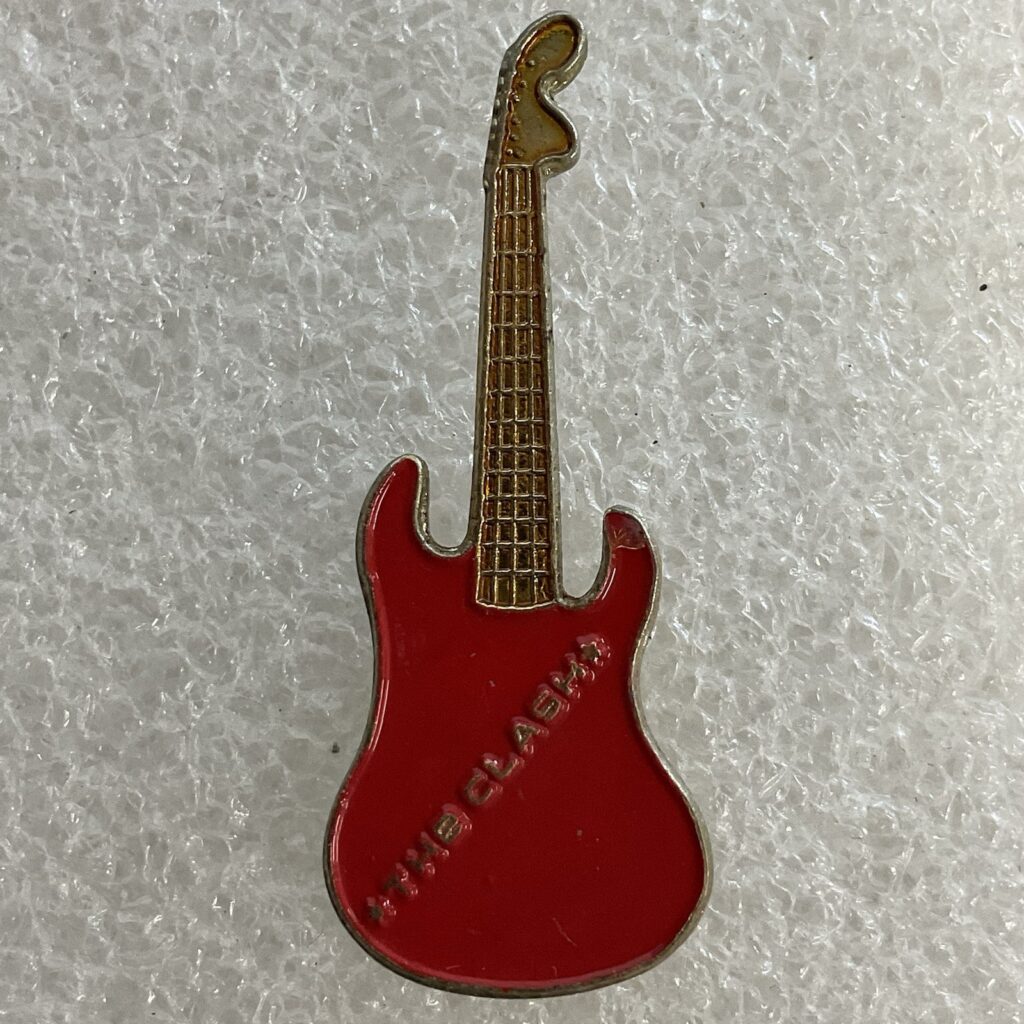 1980’s Vintage The Clash English Rock Band 1.5" Red & Gold Metal Guitar Pin - Image 1