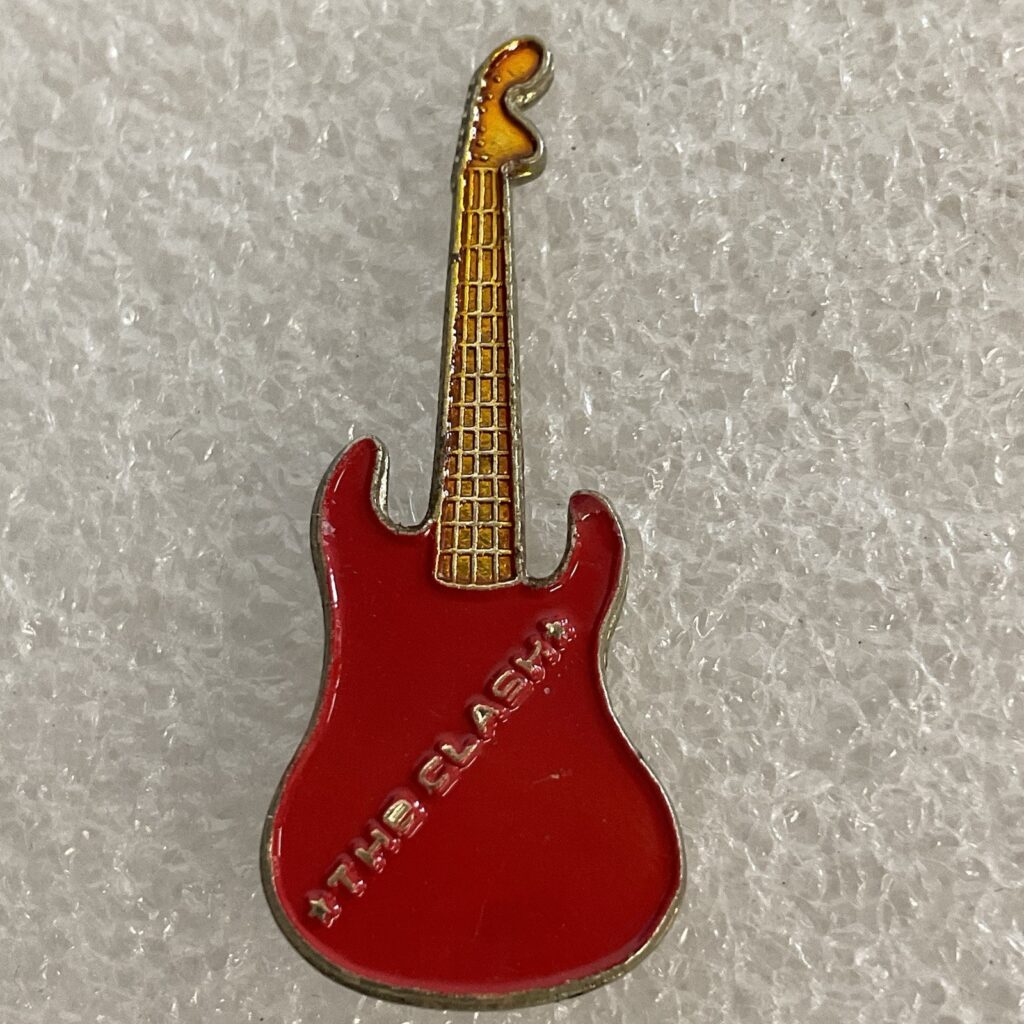 1980’s The Clash English Rock Band Vintage 1.5" Red & Gold Metal Guitar Pin - Image 1