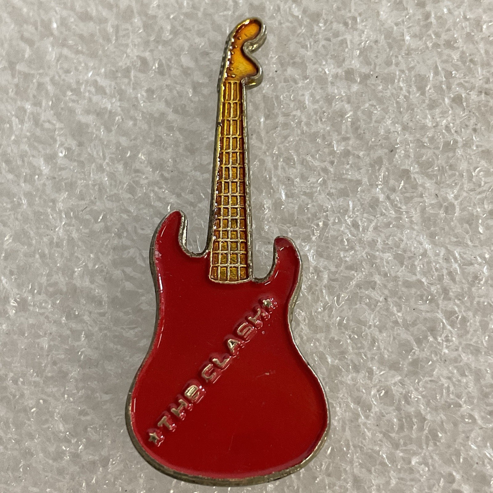 1980’s The Clash English Rock Band Vintage 1.5" Red & Gold Metal Guitar Pin - Image 1