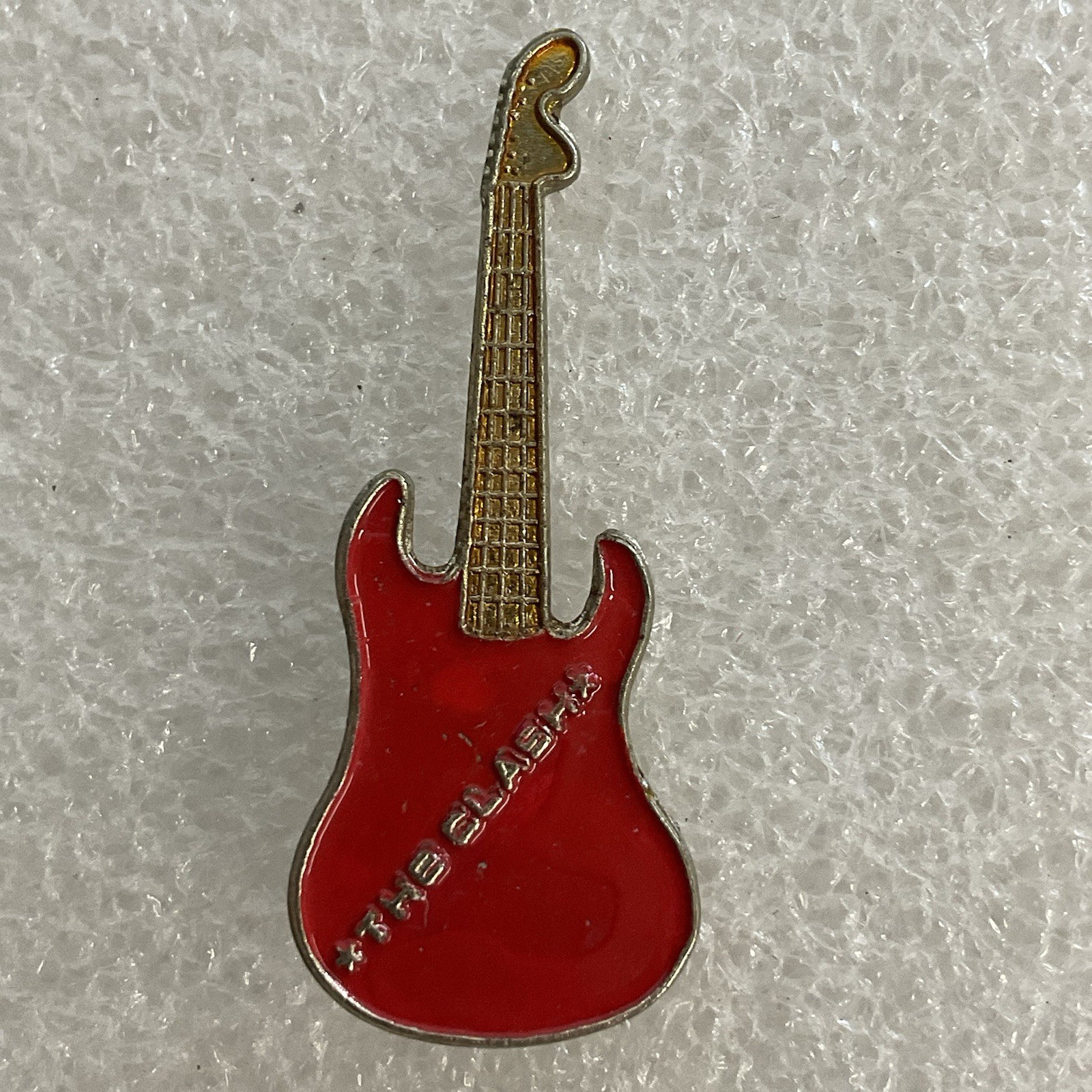 1980’s The Clash English Rock Band 1.5" Vintage Red & Gold Metal Guitar Pin - Image 1
