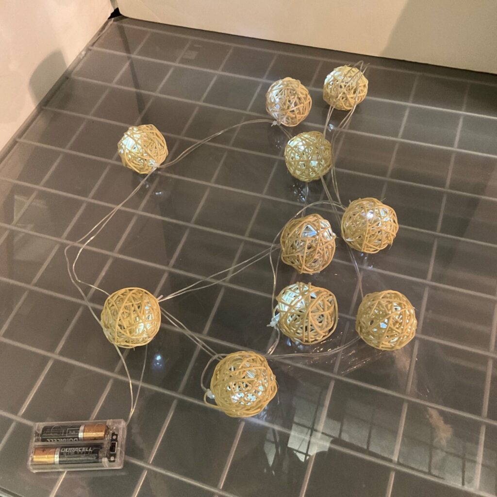 10-Light Woven Rattan Ball LED String Lights Battery Operated 2.5 in - Image 1