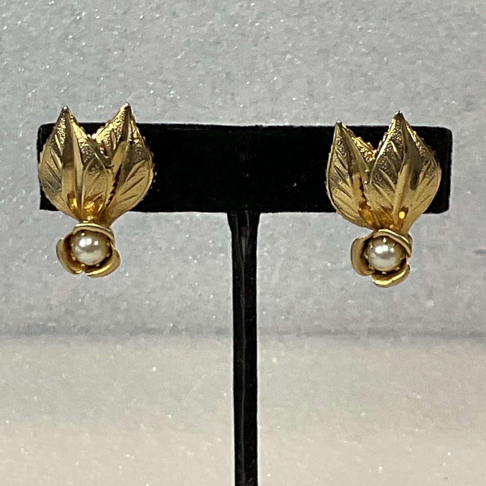 Vintage Gold Tone Leaf Clip On Earrings with Faux Pearl Floral Accents - Image 1